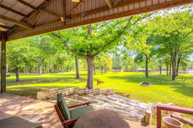 view of patio with an outdoor fire pit