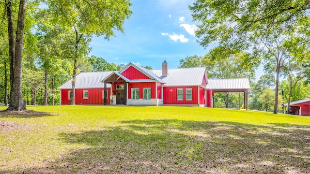 view of front of home with a front lawn and a carport