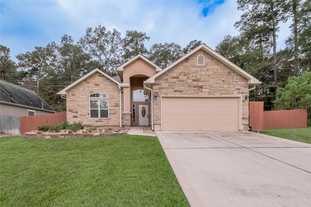 view of front facade with driveway, a front lawn, and fence