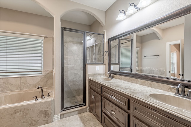 bathroom with vanity, tile patterned flooring, and separate shower and tub