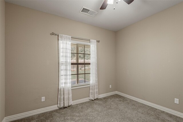 empty room with light colored carpet and ceiling fan