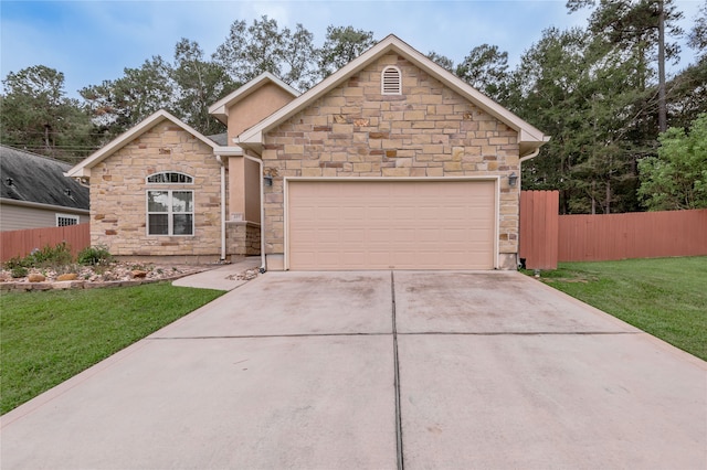 view of front facade with a garage and a front yard