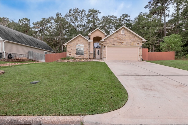 view of front of house with a garage and a front yard