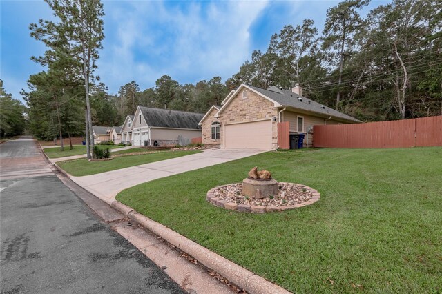 view of home's exterior with a garage and a lawn