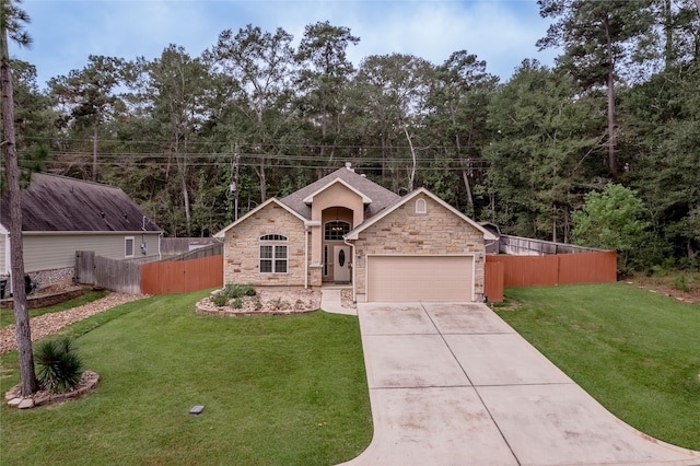 view of front of house featuring a front yard and a garage