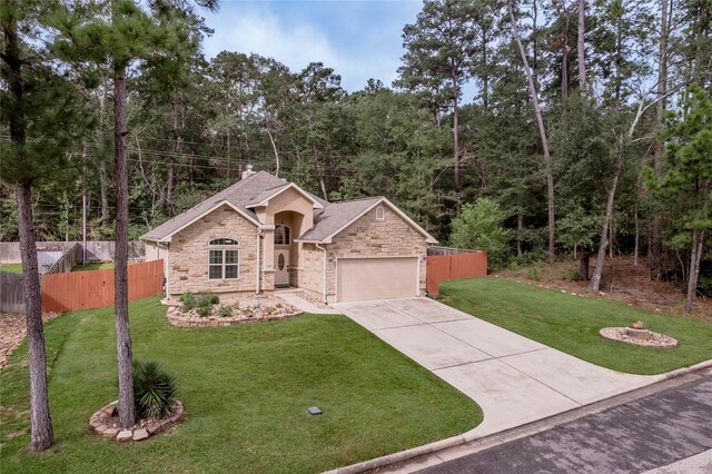 view of front of house with a garage and a front yard