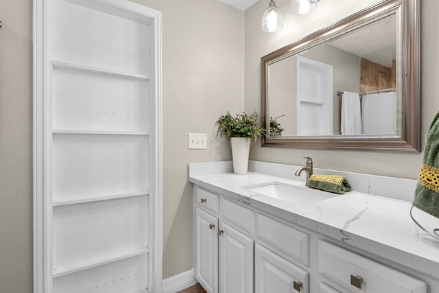 bathroom with vanity and curtained shower