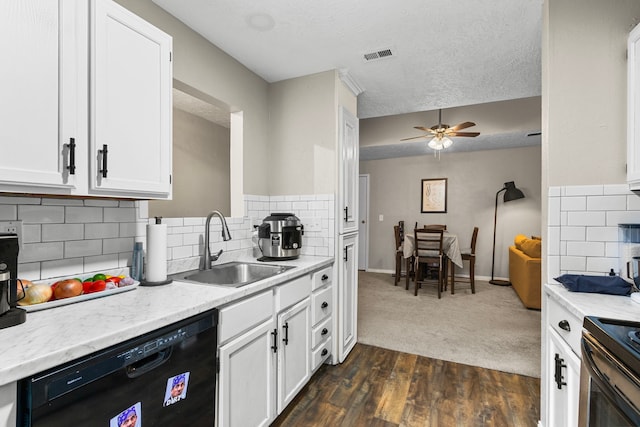 kitchen featuring white cabinets, tasteful backsplash, a textured ceiling, black appliances, and dark wood-type flooring