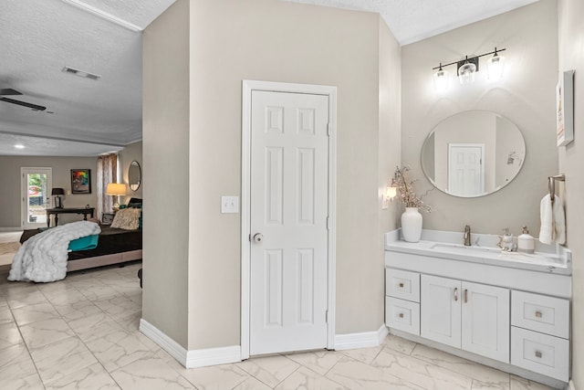 bathroom featuring vanity and a textured ceiling