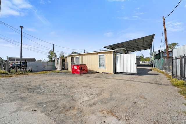 exterior space featuring a carport