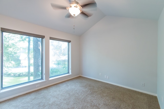 empty room with carpet floors, ceiling fan, and vaulted ceiling