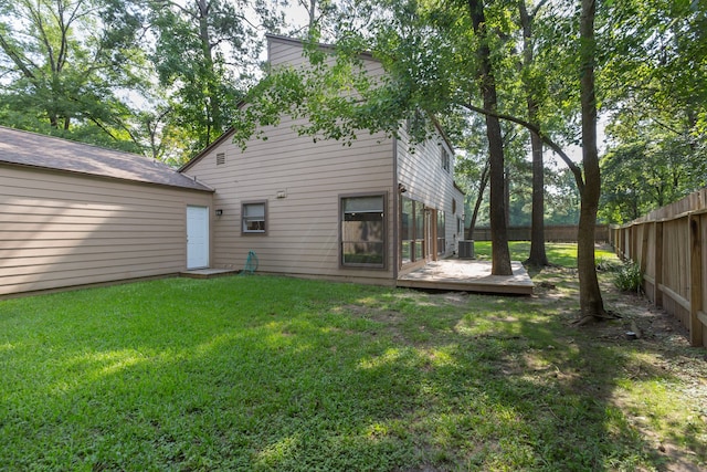 rear view of property with a lawn