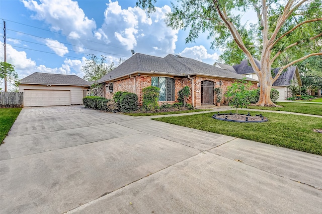 single story home featuring a front lawn and a garage