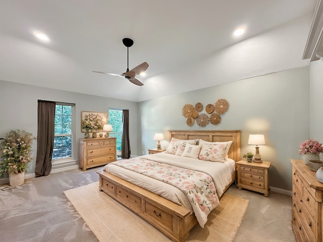 carpeted bedroom featuring ceiling fan and vaulted ceiling