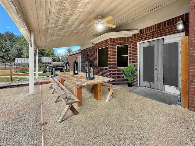 view of patio featuring ceiling fan and a grill