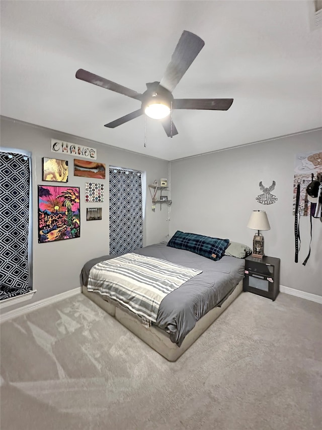 carpeted bedroom with ceiling fan