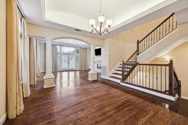 entrance foyer featuring french doors, a chandelier, and dark hardwood / wood-style flooring