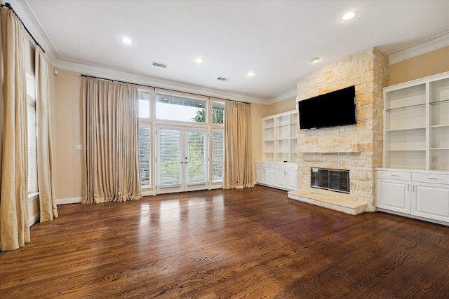 unfurnished living room featuring a fireplace, crown molding, and dark hardwood / wood-style flooring