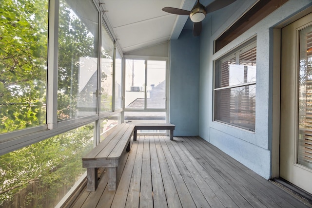 unfurnished sunroom featuring vaulted ceiling and ceiling fan