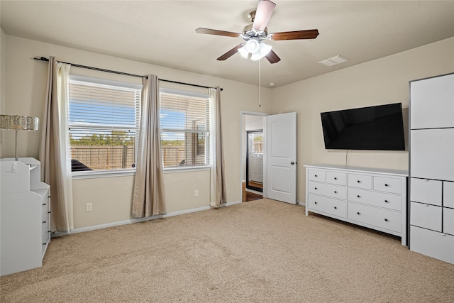 unfurnished bedroom featuring ceiling fan and light carpet