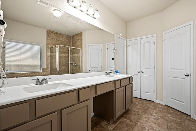 bathroom featuring vanity and a shower with door