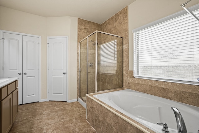 bathroom featuring vanity and plus walk in shower