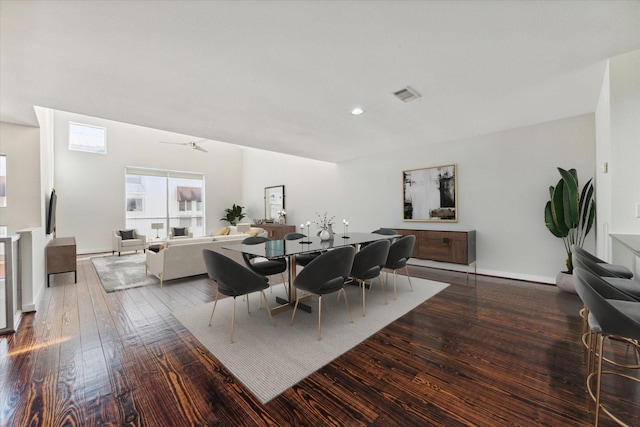 dining room with hardwood / wood-style flooring and ceiling fan