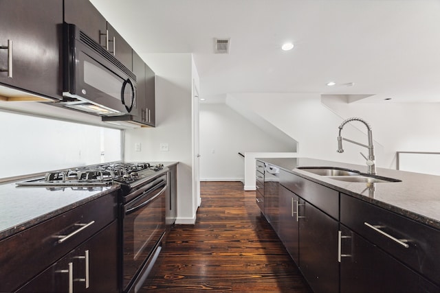 kitchen with black appliances, sink, and dark wood-type flooring