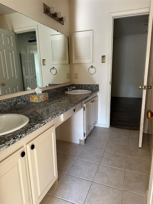 bathroom with vanity and tile patterned flooring