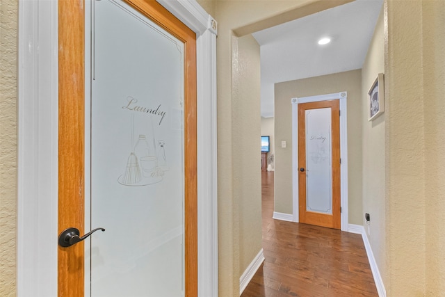 hall with dark hardwood / wood-style floors