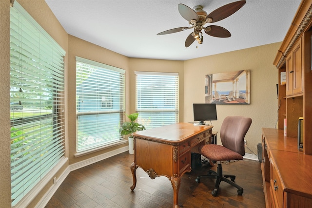 office space with ceiling fan, dark wood-type flooring, and a textured ceiling