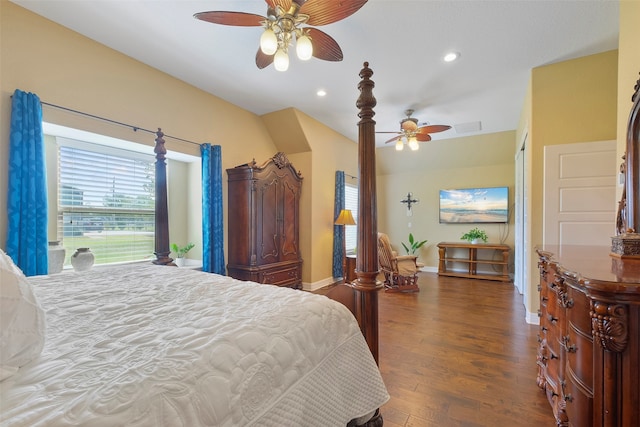 bedroom with ceiling fan and dark hardwood / wood-style flooring