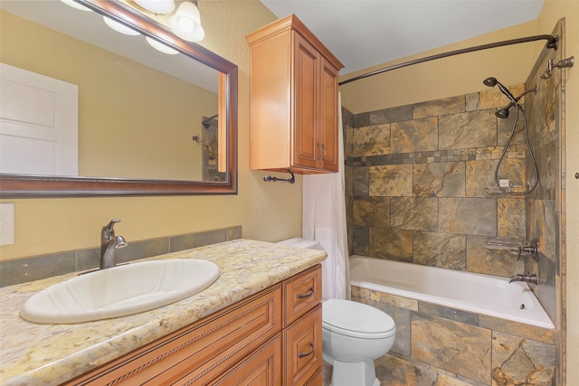 full bathroom featuring shower / bath combination with curtain, vanity, and toilet