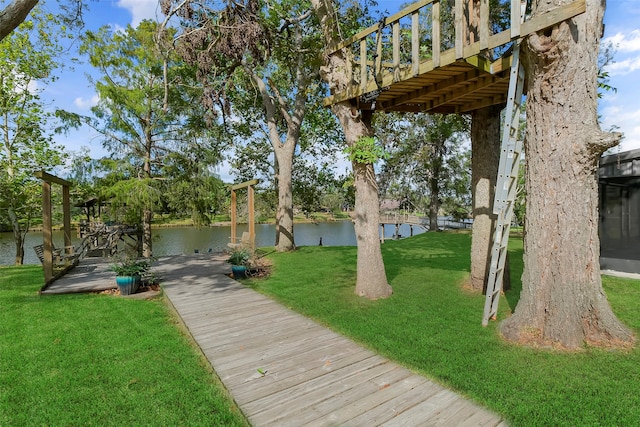 view of yard featuring a deck with water view