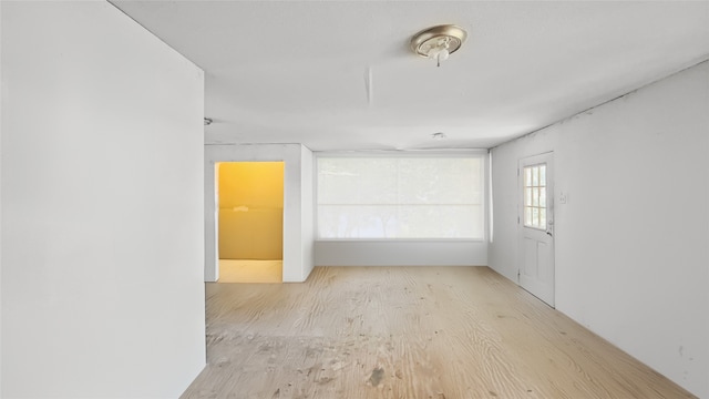 unfurnished room featuring light wood-type flooring