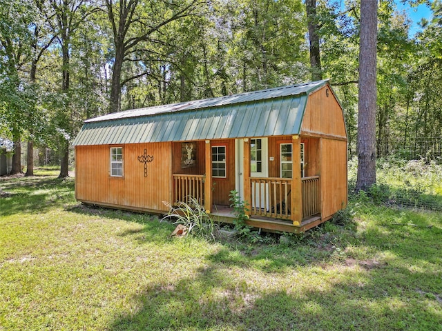 view of outbuilding with a lawn