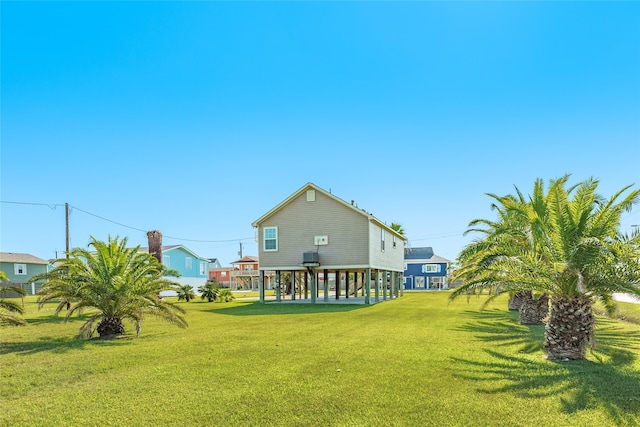 rear view of house with a lawn