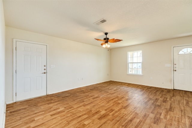 foyer entrance featuring ceiling fan and light wood-type flooring