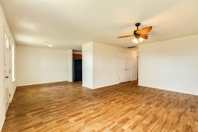 unfurnished room with light hardwood / wood-style floors and ceiling fan