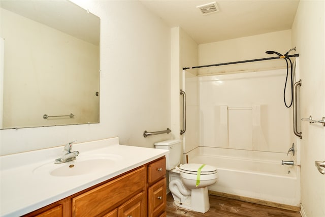 full bathroom featuring vanity, toilet, shower / tub combination, and hardwood / wood-style floors