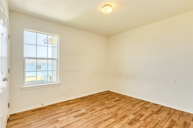 empty room with light hardwood / wood-style floors