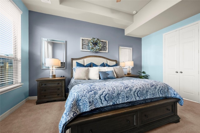 carpeted bedroom with a closet