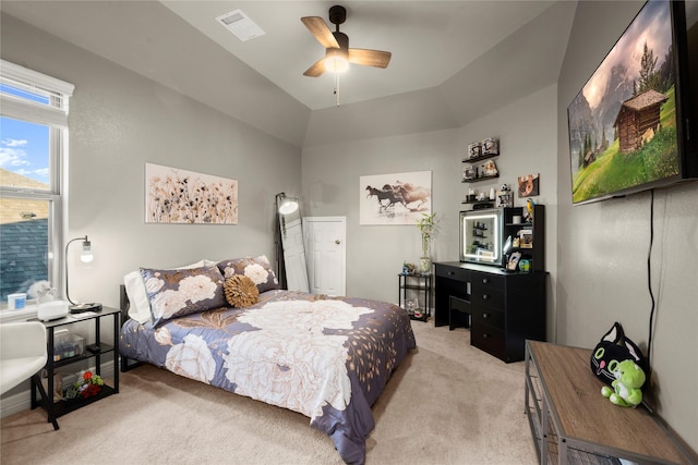 carpeted bedroom featuring vaulted ceiling and ceiling fan