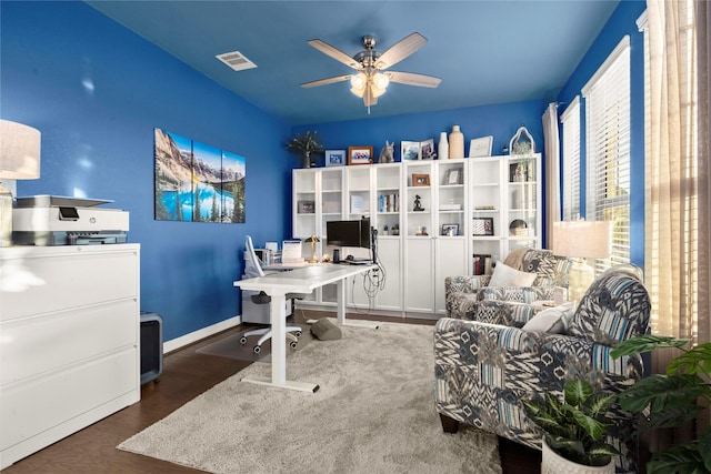 office space with ceiling fan and dark hardwood / wood-style flooring