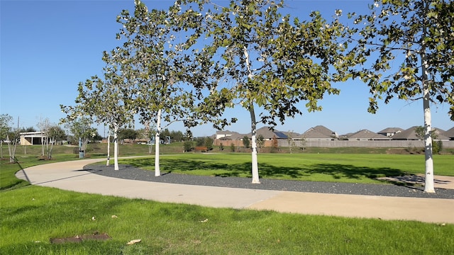 surrounding community featuring a lawn