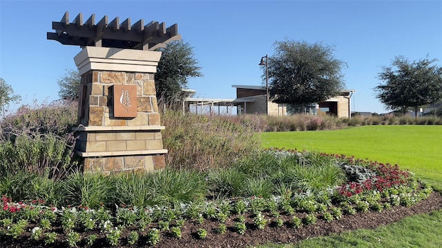 community / neighborhood sign with a lawn