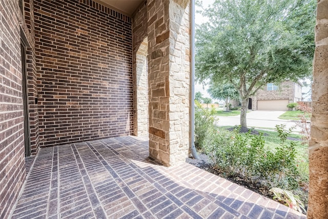 view of patio featuring a garage