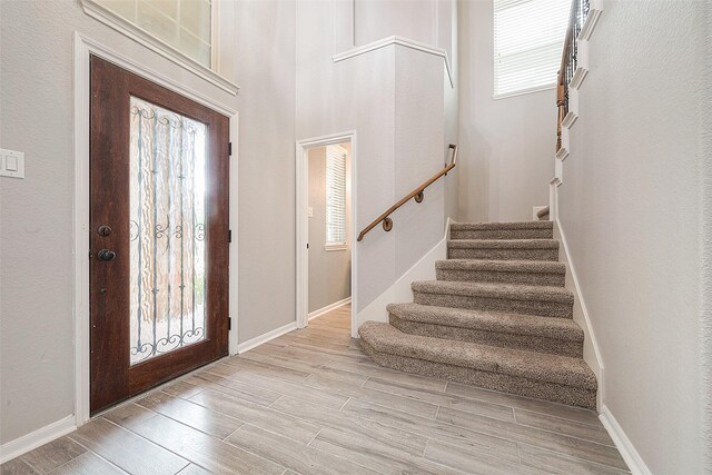 entryway with a wealth of natural light and light wood-type flooring