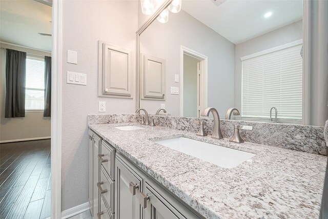 bathroom with vanity and hardwood / wood-style floors