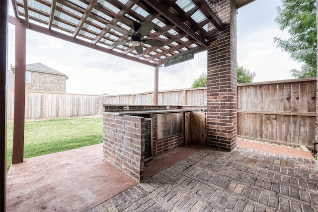 view of patio / terrace featuring ceiling fan and a pergola